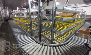 Gravity racking as the basis of a highly efficient warehouse system