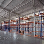 Grated fencing of racks in a warehouse with gates